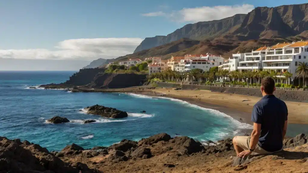 Hombre contemplando la costa de Tenerife, símbolo de nuevas oportunidades y alivio financiero a través de la Ley de Segunda Oportunidad en Tenerife.