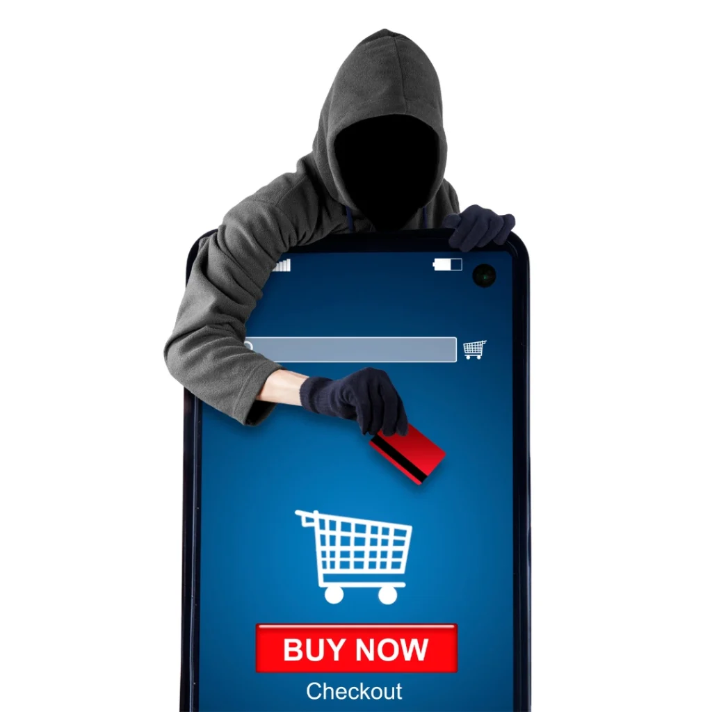 Imagen conceptual de un ciberdelincuente saliendo de un móvil con una tarjeta bancaria en la mano, representando fraudes en compras online y la necesidad de saber cómo denunciar una compra online en España.